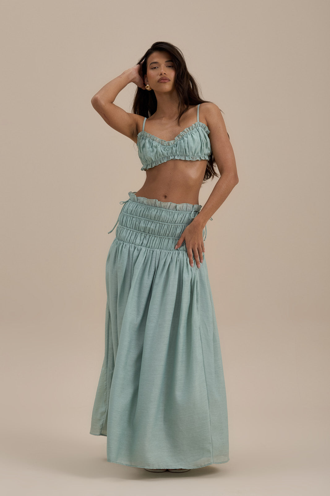 Model wearing Soulie Bra Top in Sage, front view showcasing ruched design and delicate frills - Wanderdoll