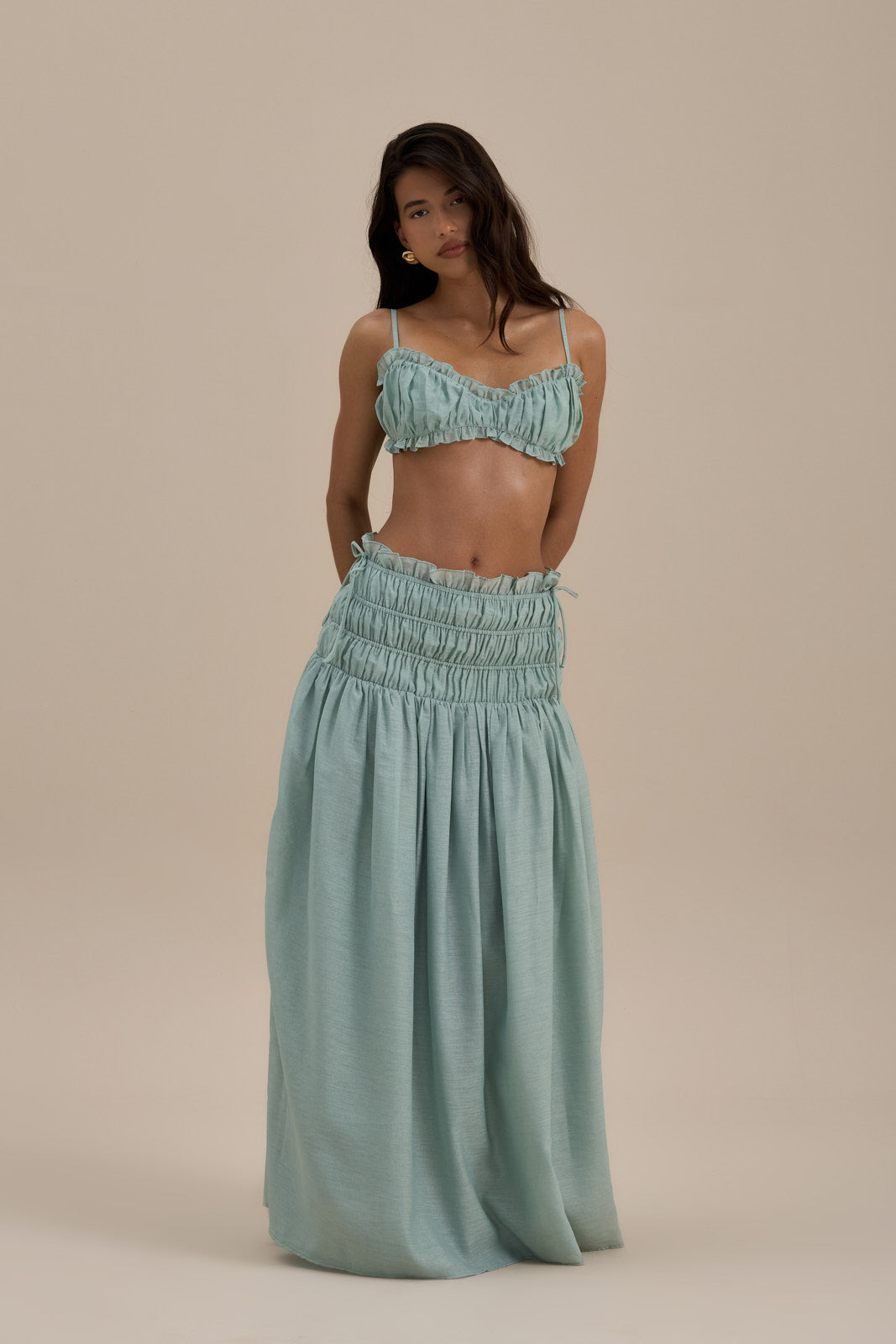 Model wearing Soulie Bra Top in Sage, front view showcasing ruched design and delicate frills - Wanderdoll