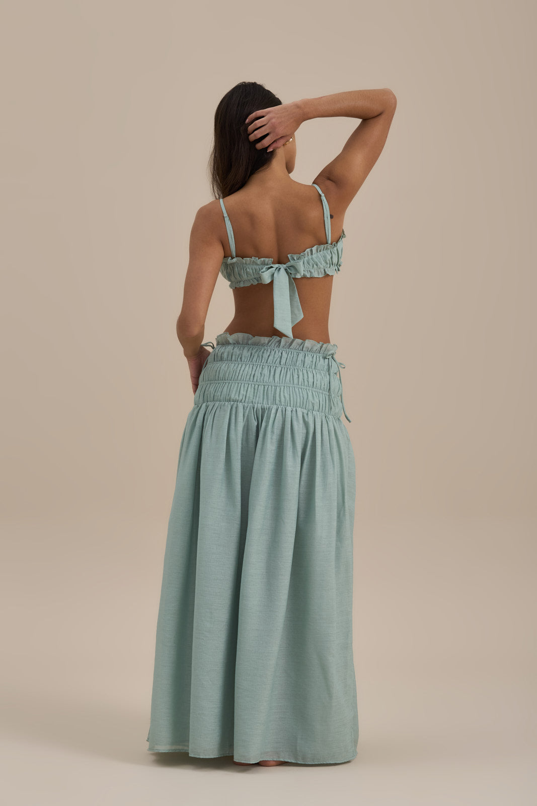Model wearing SOULIE BRA TOP in Sage, ruched bralette with frill trim, front view - Wanderdoll