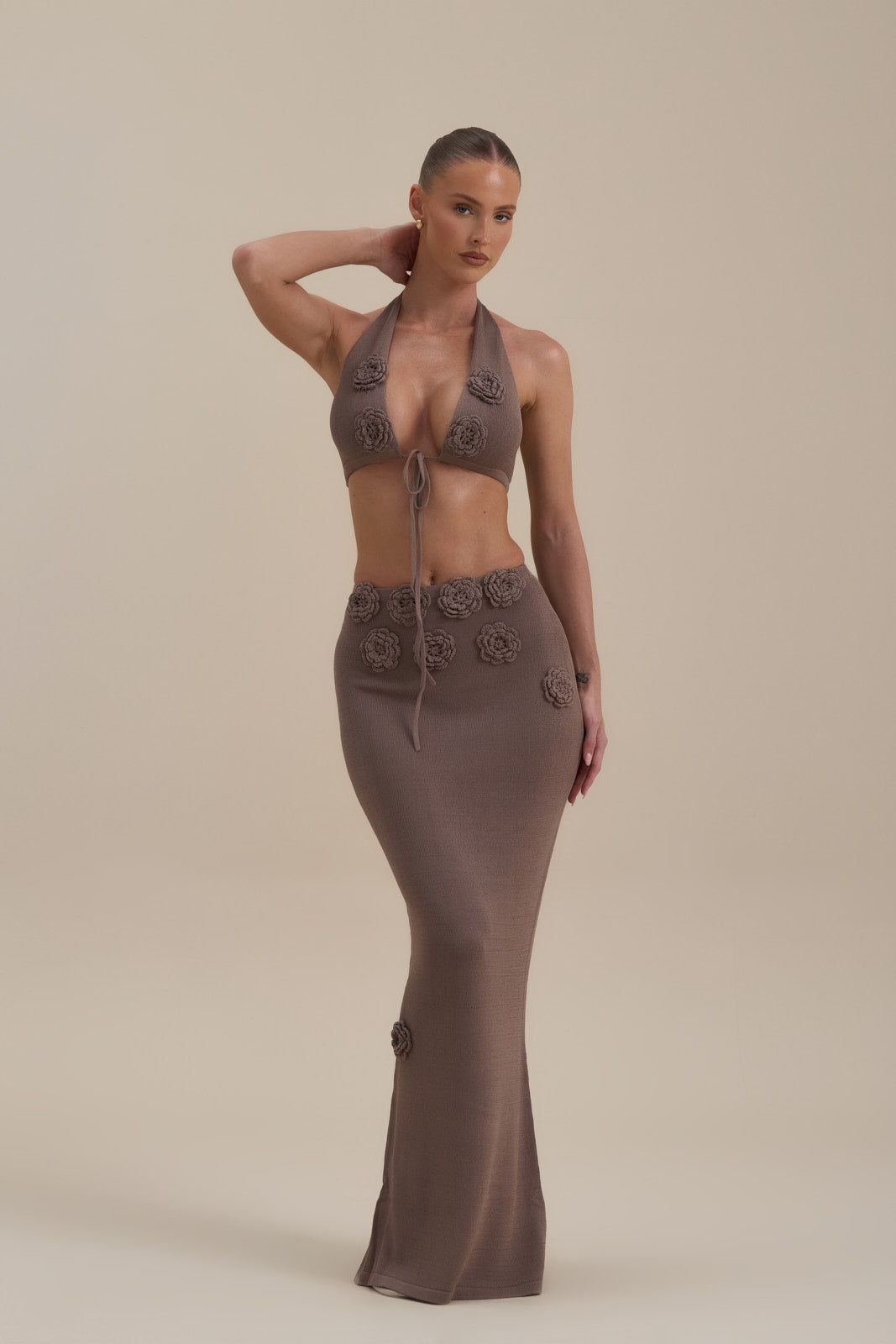 Model wearing Daisy Maxi Skirt in Mocha Mousse, front and side view with 3D floral appliqués - Wanderdoll