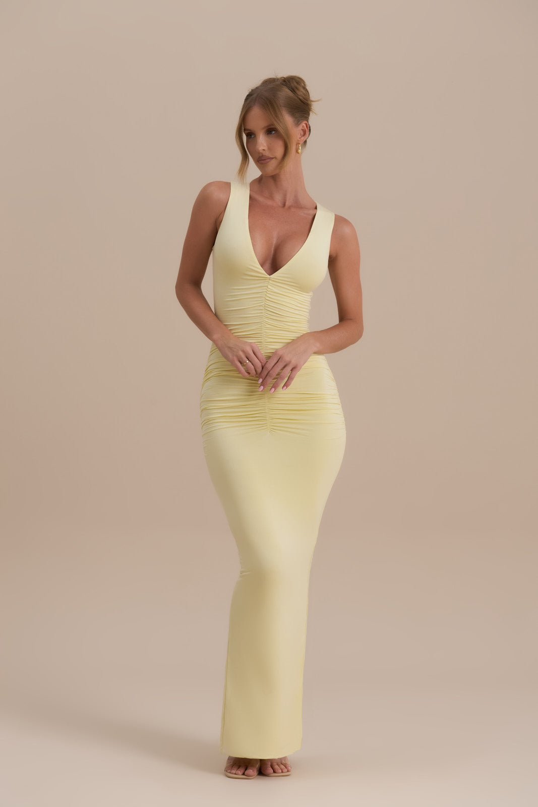 Model wearing Tate Maxi Dress in Lemon, showcasing plunging neckline and ruched detail - Wanderdoll