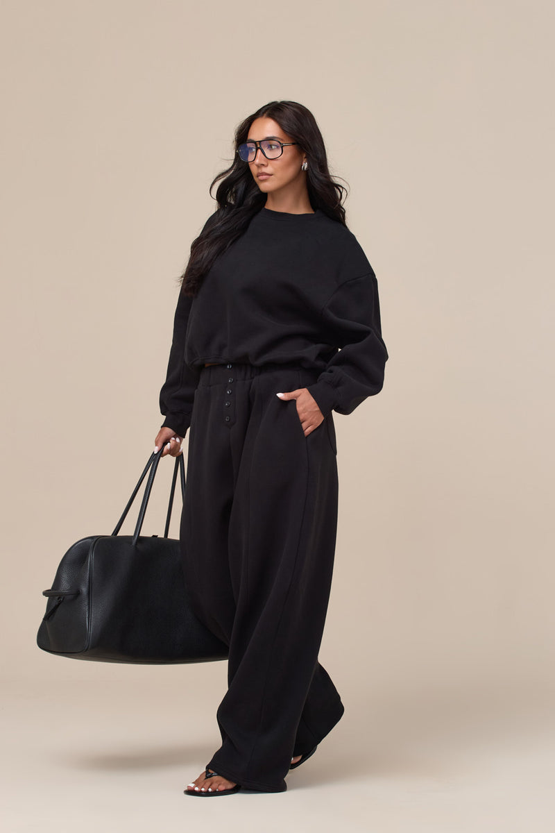 LANE BUTTON BALLOON LEG SWEATPANTS | BLACK
